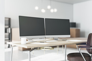 Black computer monitors with copyspace for your text on stylish eco style table in sunny home office room. 3D rendering, mock up