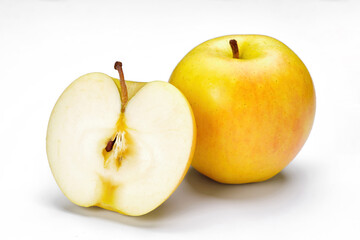 a whole flesh yellow-red orin apple  covered with small water droplet and another half isolated in white background with clipping path