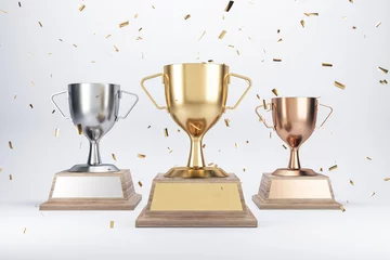 Fotobehang Winner concept with golden, silver and bronze cups with blank nameplates under confetti on abstract light background. 3D rendering, mockup © Who is Danny