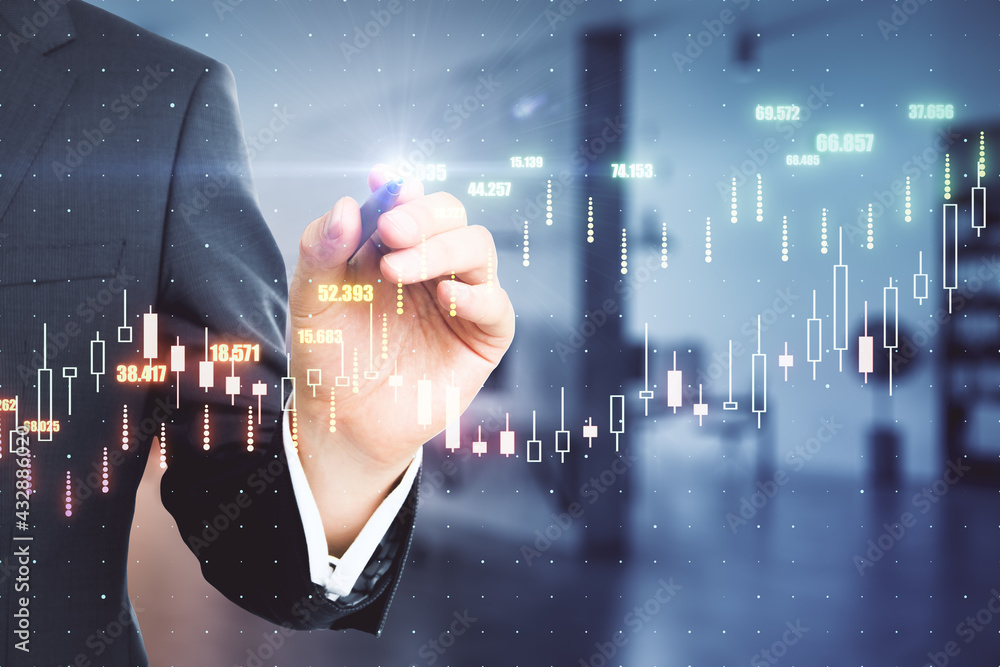Poster Analysis and investing concept with man writing on virtual screen with digital financial chart graphs. Double exposure.