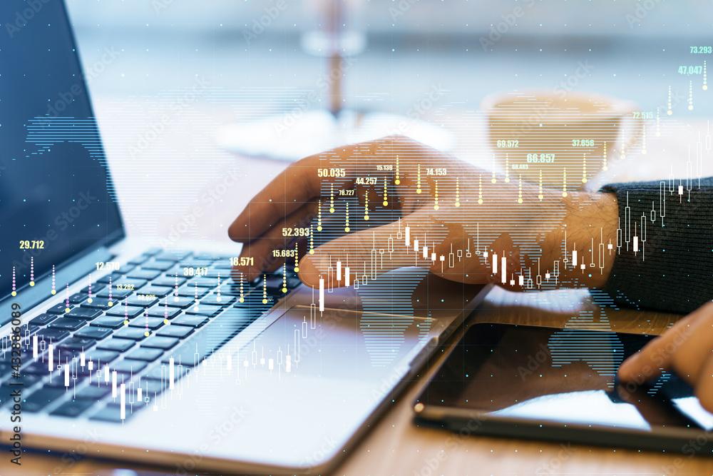 Poster stock market concept with digital growing forex chart graphs and candlestick on man hands with lapto