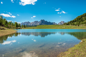 Calm lake in a sunny day  in the beautiful Carnic Alps, Friuli-Venezia Giulia, Italy