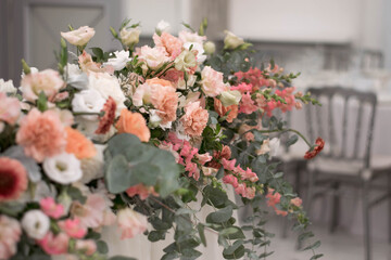 Obraz na płótnie Canvas Close up of flower arrangement for wedding main table at a wedding reception.