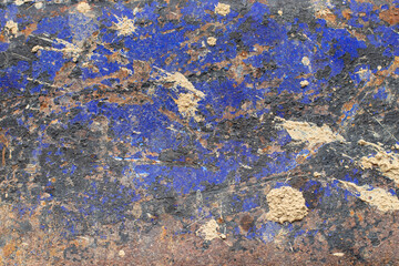 The blue pattern peels off from the steel.