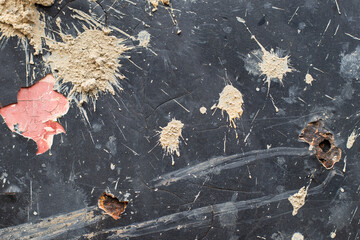 Black peeling from the side of the dump truck