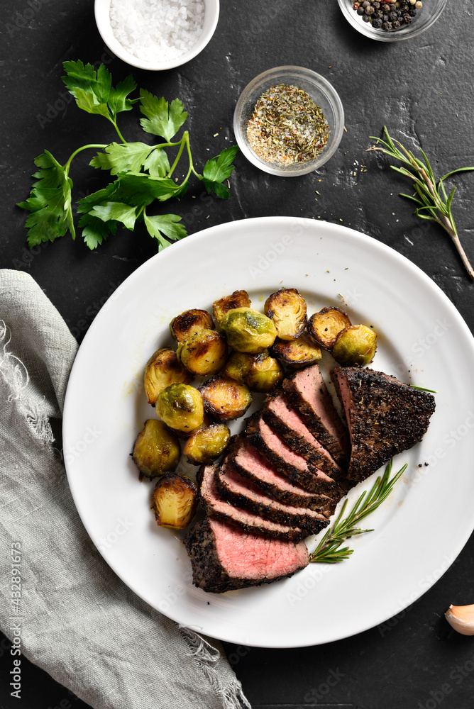 Wall mural grilled beef steak with brussels sprouts