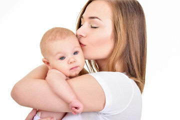 Mother and baby playing and smiling. Happy family.