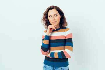 Curious young woman wearing casual outfit