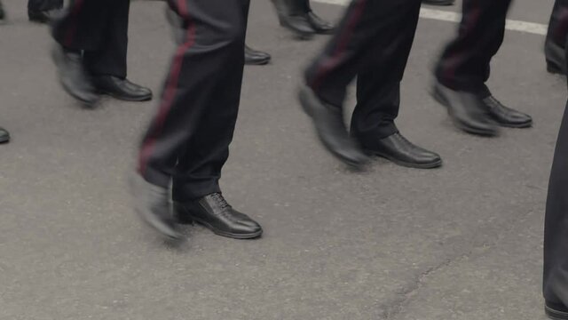 Close-up of the legs of the military, who march on the parade