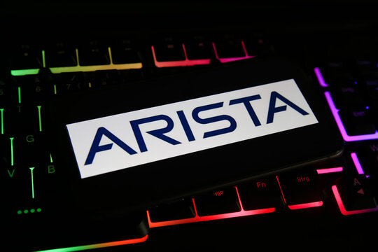Viersen, Germany - May 1. 2021: Closeup of mobile phone screen with logo lettering of arista networks on computer keyboard