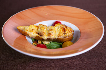 baked pear with tomatoes on a plate