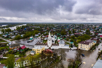 a panoramic view of the river and the historic center of Gorokhovets during the rain filmed from a drone 