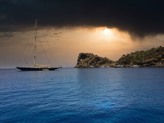 a sailship on the ocean is ready to start from the bay