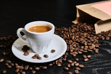 fresh cup of espresso on black table