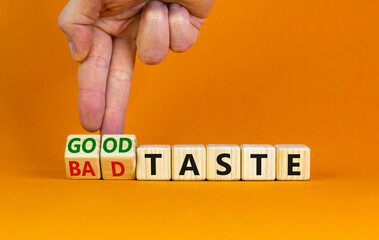 Good or bad taste symbol. Businessman turns wooden cubes and changes words 'bad taste' to 'good...