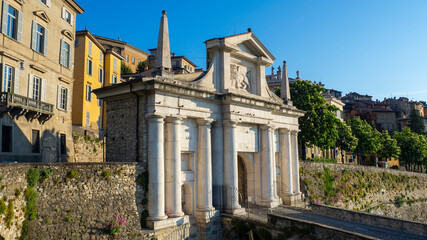Fototapeta premium Bergamo, Italy. The old town. Amazing view at the ancient gate Porta San Giacomo. Bergamo one of the most beautiful cities in Italy. Tourists destination