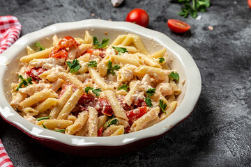 cooked baked feta pasta. Trending viral Feta pasta recipe with tomatoes, cheese, garlic and herbs in a casserole dish. banner, menu recipe place for text, top view