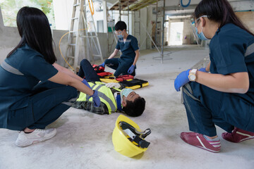 Emergency Medical First aid for head injuries of worker accident in work, Loss of feeling or loss...