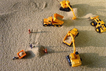 Concept of Head Man Control Construction Machine with Workers or Labour while Moving Sand in...