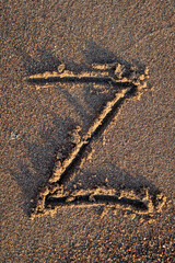 english letters written in the sand
