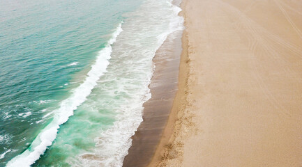 Top view of beautiful dreamy beach. Peaceful coastline without people. Place to rest and relax near ocea wuth turquoise water. Aerial view