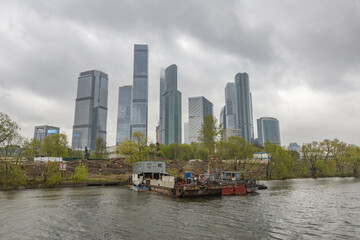Fototapeta premium Glass skyscraper of the Moscow City business center in cloudy weather. Russia