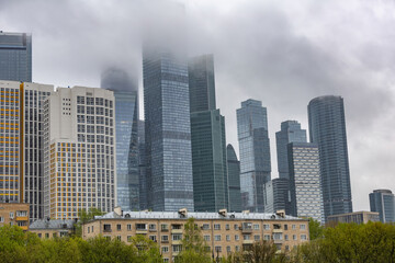 Fototapeta na wymiar Glass skyscraper of the Moscow City business center in cloudy weather. Russia