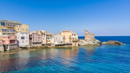 Corsica, Drone view of the village of Erbalunga and its Genoese tower. Erbalunga is a charming village of character on the Corsican coast, remarkable for its ruined Genoese tower 