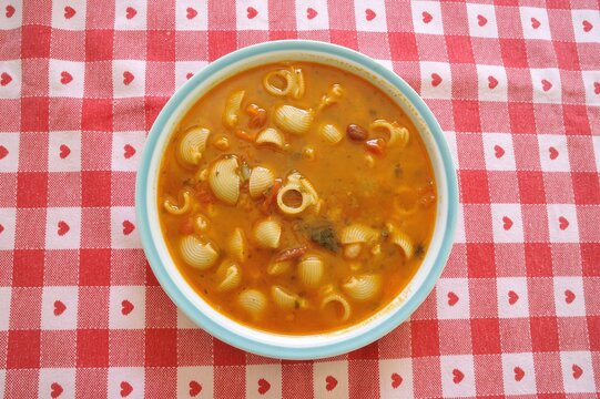 Italian minestrone dish typical of healthy and healthy Italian cuisine with vegetables, beans, potatoes, peas, pasta