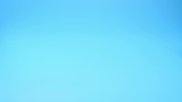 Clockwork mouse runs on a blue background. 