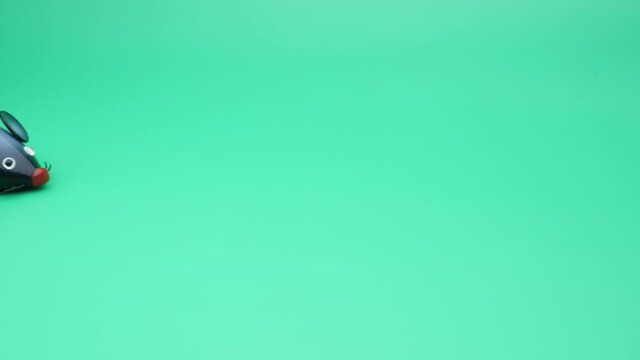 Clockwork mice runs on a green background. Seamless loop.