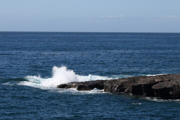 waves crashing on rocks