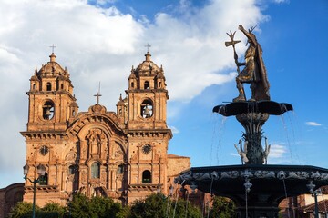 fountain and catholic church Cusco or Cuzco town Peru