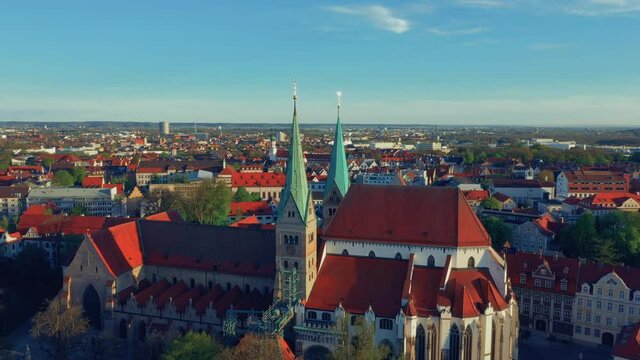 Augsburger Dom. Drone flying around the church. Red roofs background. Augsburg Germany Bayern