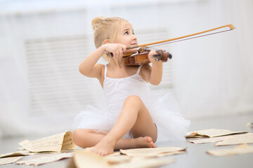 ballerina playing the violin