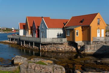 Norwegian houses on the shore of Fedje Island, morning time. Western part of Norway, Nordhordland.