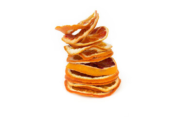 Heap dried orange slices on a white isolated background