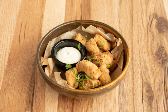 nice wooden bowl with pieces of marinated dogfish