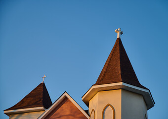 Church steeple against blue sky