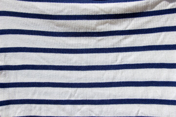 Abstract striped background. Blue and white stripes on the fabric