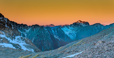 Southern alps in sunset time, looking east, orange glowing atmosphere.
