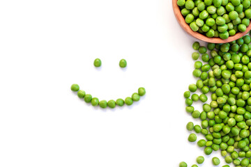 Smiling green peas face on white background. 