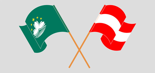 Crossed and waving flags of Macau and Austria