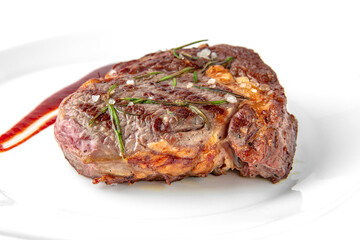 Dry aged beef steak Medium Rare. Banquet festive dishes. Gourmet restaurant menu. White background.