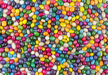 Fototapeta na wymiar Colorful background of colorful round candy drops. Assorted bright candy balls or dragees. Color background.