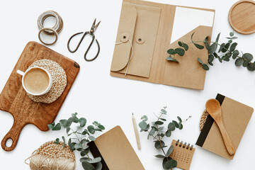 Flat lay workspace with cup of coffee and notes. Ideas, notes or plan writing concept. Minimal eco...