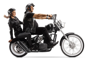 Fototapeta na wymiar Biker riding a woman on a custom chopper motorbike