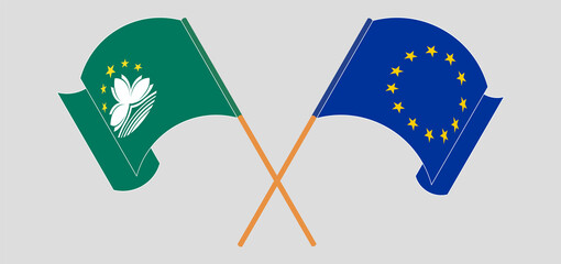 Crossed and waving flags of Macau and the European Union