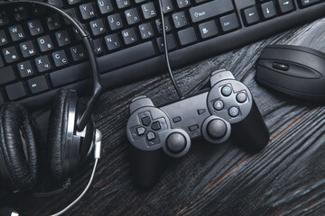 Game controller with headphones, mouse and computer keyboard. © andranik123