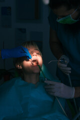 Closeup dental examination on a female patient in the office of the dentist